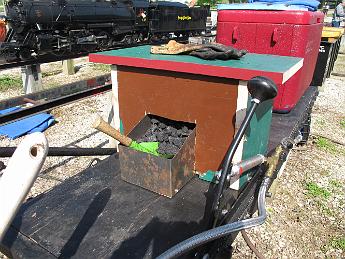  The new seat / coal bunker.  Lift the seat to fill, scoop from the front. I designed it, Dad constructed it, I finished the metal bunker. Could use a coat of paint and some padding for the seat!