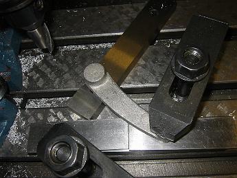 TumblingShaftLever12Nov08 005 Clamping attempt #1 for the left Tumbling Shaft Lever.  This did not have enough support to keep the part from moving under the cutter.