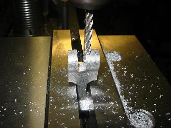 ValveGear10Dec08 002 Back and forth we go, taking a little more off each time.  After we have milled the middle away, we go back and do a finish pass on each side to get the 'ears' to the finished thickness.