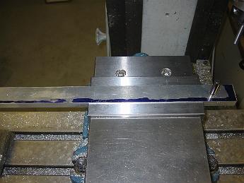 ValveGear3Dec08 001 3-Dec-08.  To accurately lay out the holes for the Radius Rod and Eccentric Rod, we build a drill fixture.  using a piece of aluminum tooling plate, we machined the top and bottom clamping side parallel, then drilled, bored and pushed a dowel pin in which exactly fits the unbushed hole in the radius rod.