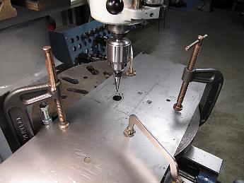 CylinderJacketing3June09 003 Drilling the holes in the sheet metal really calls for a drill press, not a mill.  Since my 1930's era Barnes 14