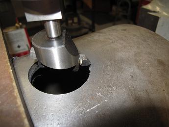DrillingSmokeboxShell21Feb09 006 When we advance to the next larger cutter, we have to look around to find a carbide cutter to put in it. We can run carbide twice a fast and take a heavier cut each time, speeding each boring pass up considerably.  Unfortunately, this cutter which looked like it had enough clearance, did not perform well in this setup at all, producing lots of chatter and a lousy finish. We have to switch back to a HSS bit.