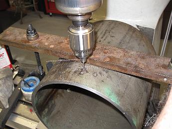DrillingSmokeboxShell21Feb09 008 After a hole is drilled, we loosen the top bridging clamp, roll the pipe and line up to the next scribe mark. Here we are drilling the holes for the side step.