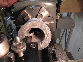 SmokeStackDrilling25Feb08 002 25-Feb-09 With the six jaw holding the end of the smokestack and a boring bar in the tool holder, we turn the recess for the petticoat per the print.