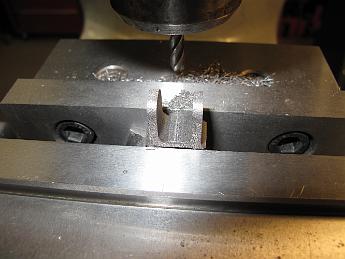 SmokeboxHinges28Mar08 002 Using a ball end mill, we clean up and machine the hinge tabs.  Since these brackets are cast iron, we use a carbide mill.  I think the results look good!