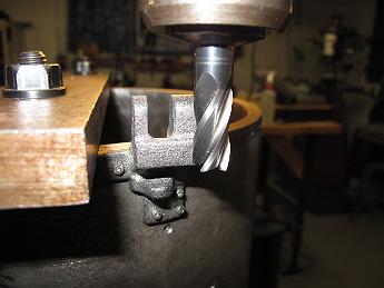 SmokeboxShellHinges1Apr08 003 Using a larger ball end mill, we finish the lower hinge support. We also skim the outside of the hinge to get a vertical reference surface.
