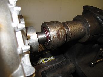 SmokeboxStarted4Feb09 002 Our 'live center' is a shop made affair of many years ago using an open cage tapered roller bearing.  I had to dunk it in the solvent tank to clean out the gunk and dirt, then greased it up a bit.  The inner race is not captive so if you back the tailstock off, the bearing will fall out, which also gets it dirty again.  It needs to have a proper live center made.  You can spend your time making tooling or making parts, this time it was parts.