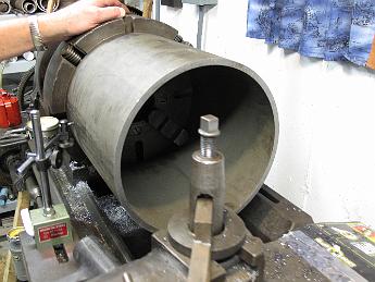 TurningSmokeboxShell11Feb09 003 Finishing the centering operation with the dial indicator.  Next we clamp down a nice sharp piece of high speed steel in the lantern style tool post and face the end of the pipe.
