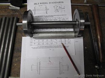 IMG_5367 18-Jan-2014 You would think I'd have this all figured out by now, but sure enough, the draftsman (me) made a dimensional error on the wheel spacing. Fortunately for me, Bill's 50 years of experience caught the error after machining one axle. We make a reference gauge to check the back-to-back wheel dimensions.