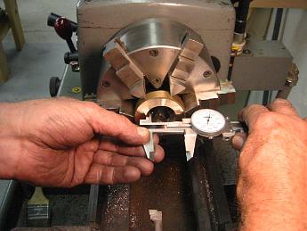 Wheels 017 13-Jul-05 Machining a brass spacer to put between the two wheels. We discovered the crankpin holes on each wheel did not line up correctly when placed on a keyed shaft. We will put this spacer between two wheels, back-to-back, to bore out the crank pin holes.