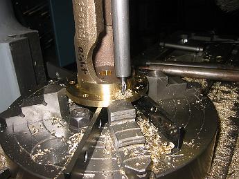 MikadoPistonCovers04Oct06 001 4-Oct-06  We discover the holes previously drilled are 0.014 off.  We don't know why, maybe the y-axis handle got bumped.  We have to make a custom endmill holder to mill the holes back to their proper place. A minor, but two-hour, setback for that nights activities.