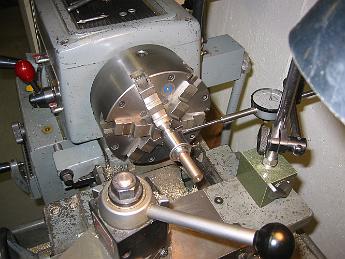 MikadoValveCovers18Sept6 003 18-Sept-06 Making an arbor for a small Jacobs chuck. The drill chuck is clamped to a dowel pin, we indicate off the chuck body to remove the run-out.